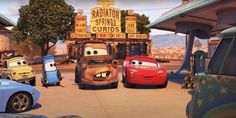 cars lined up in front of a gas station with the characters from disney's cars