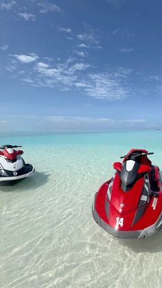 two jet skis in the water near one another