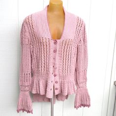 One Of A Kind Handmade Crochet Jacket With Many Unique Styling Details. Ruffled Hem In Front With A Gathered Peplum Pleated Look Long Tail In Back, Reminiscent Of Ladies Coat Jackets In The 1800's. Ruffled Bell Cuffs And A Knit-In Collar. Pale Dusty Pink Accented And Edged With Mauve On The Cuffs, Neckline And Covered Buttons. Beautiful! A Glasswear Art Couture Original Design. Artisan Designed And Made. 60% Rayon (Bamboo), 40% Cotton. Handwash And Dry Flat. Armpit To Armpit: 20" Flat With Lots Ladies Coat, Unique Styling, Crochet Coat, Crochet Jacket, Artisan Design, Long Tail, Covered Buttons, Dusty Pink, Handmade Crochet