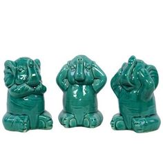 three green ceramic elephants sitting next to each other