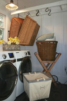 a washer and dryer sitting next to each other in a room