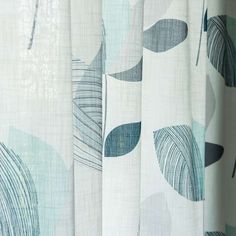 curtains with blue and green leaves on them