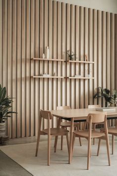 A Japandi-style dining room with a minimalistic blue accent wall and natural wood elements. Unique Accent Walls, Accent Wall Inspiration, Japandi Dining Room, Japandi Dining