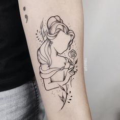 a woman's arm with a tattoo on it and a flower in the middle