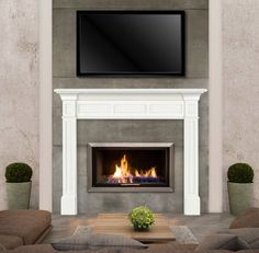 a living room with a fireplace and flat screen tv on the wall