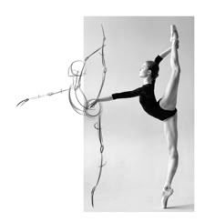 a black and white photo of a ballerina in the middle of an artistic pose