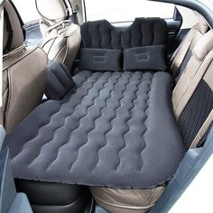 an inflatable car seat with two pillows on it