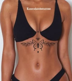 a woman with a butterfly tattoo on her stomach