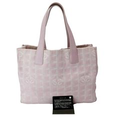 Item Details: Designer: CHANEL?ÿ Model:?ÿTravel Line Retail:?ÿN/A Style: Tote Bag Material: Nylon and Leather Color: Light Pink Date: France Measurements: W 14" x H 10" D 6" Accessories:?ÿity Card. Condition Detail: Very Good - The Item is gently used and may have minor corner rubbing, light leather tanning, some inside stain marks, and slight signs of use on hardware. See the listing description for details. Outside: Signs of use. Inside: Dirt marks, signs of use. Nylon: Dirt marks, signs of use. Leather: Scratches, wrinkles, signs of use. Corners: Dirt marks, signs of use. Hardware: Scratches, signs of use. Strap: Light scratches, wrinkles,?ÿsigns of use. Smell: No Smell. Please check the details and pictures before purchasing.Please do not hesitate to ask questions regarding our product Outside Signs, Logo Travel, Nylon Tote Bag, Nylon Tote Bags, Pink Chanel, Travel Logo, Chanel Model, Nylon Tote, Bag Light