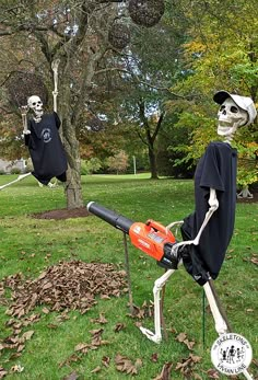 two skeletons in halloween costumes with chainsaws on their heads, one holding a saw