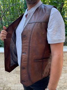 It is made of very useful and soft sheep and lamb leather. There are 2 pockets and button details on the product. Made of 100% leather. The right choice for a special day gift to your loved ones. Mens Western Vest, Mens Leather Waistcoat, Brown Leather Vest, Leather Tanning, Celtic Dress, Mens Vest Casual, Vintage Western Wear, Steampunk Leather, Western Vest