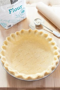 an uncooked pie crust on a wooden table