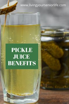 pickle juice benefits in a glass with pickles on the table next to it