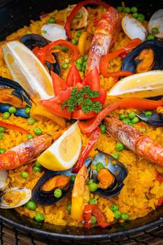 a large pan filled with seafood and rice