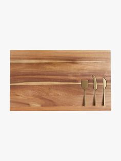 Wood Board with Cheese Knives embedded in it.