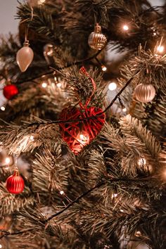 a christmas tree with ornaments and lights on it