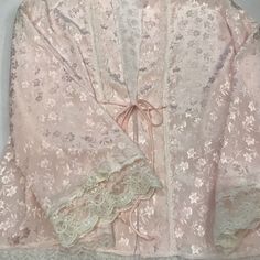 Reasonable Offers Will Be Considered Vintage Christian Dior Night Gown Bed Jacket In Light Pink Floral Pattern In The Fabric With Lace Trimmed And Few Pearls Beads With Satin Bows On Each Side Of The Sleeves Laces. 100% Polyester Hand Wash With Cold Water Size : S Reasonable Offers Welcome No Return Accepted Elegant Long Sleeve Robe For Sleepover, Spring Pink Lace Nightgown, Elegant Pink Sleepwear For Loungewear, Feminine Lace Robe For Sleep, Feminine Lace Sleepwear, Feminine Spring Robe For Wedding Night, Pink Lace Nightgown For Sleepovers, Elegant Pink Long Sleeve Sleepwear, Feminine Spring Wedding Night Robe