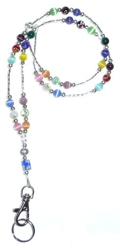 a multicolored beaded lanyard with a metal hook on a white background