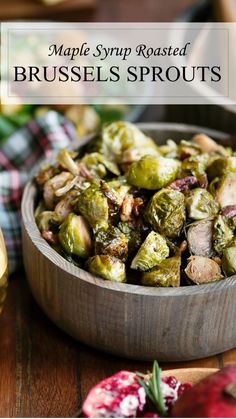 brussel sprouts in a wooden bowl next to two glasses of wine