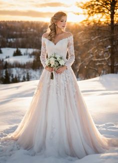 a woman in a wedding dress standing in the snow with her hands on her hips