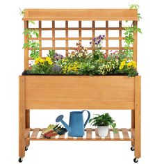 a wooden planter filled with lots of flowers