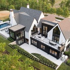 an aerial view of a large house with pool