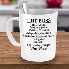 a white coffee mug with the words, the boss and other things in black on it