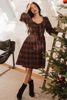 * NOTE: We recommend sizing down 1 size in this dress  The Margo Short Dress is our knee length version of this timeless holiday style. Constructed from a classic red and green plaid print, this dress features a smocked panel in the back and a large beautiful bow in front. Finished with a hidden back zipper and long sl Beautiful Christmas Outfits, Dress Ideas For Christmas, Gingham Dress Fall, Casual Christmas Dress, Cute Christmas Dresses For Women, Holiday Tea Party Outfit, 80s Christmas Fashion, Green Christmas Dresses, Christmas Dresses Aesthetic