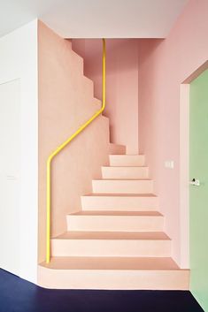 the stairs are painted pink and yellow