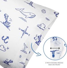 a close up of a pillow with blue drawings on it and an arrow pointing to the side