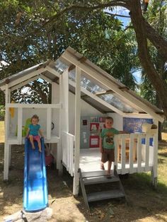 two children are playing in a play house