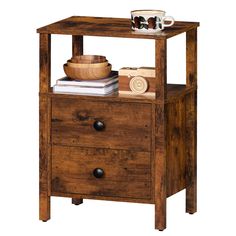 a small wooden table with two drawers and a bowl on top of the shelf next to it