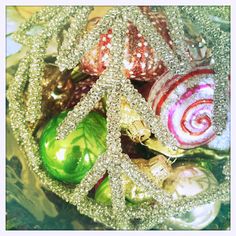 christmas ornaments are sitting in a glass bowl