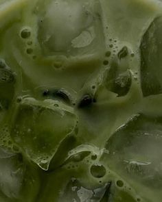 green liquid in a bowl filled with ice