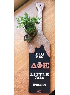 The paddle I made for my Big. Rose gold glitter, mod podge, black and white paint, and wooden letters! Trendy Sorority Paddle, Birthday Paddle Sorority, Paddle For Big Sorority, Dphie Paddle, Paddle Inspiration Sorority, Pledge Mom Paddle Sorority, 21st Birthday Paddle, Sorority Baskets