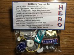 a sign that says soldiers support kit and some items inside it on a table top