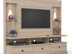 an entertainment center with a flat screen tv mounted on it's side and drawers