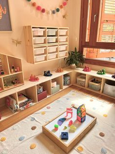 a child's playroom with toys on the floor