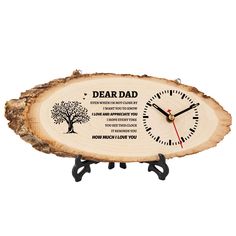 a wooden clock with the words dead dad on it and a tree slice as its base