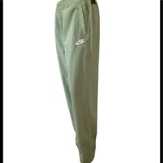 Nwt Nike Air Sportswear’s Woven Pants Women’s Sz Medium Regular, Soft Green Color, Cz9347-006, Waist Adjustable Drawstring, Pull On, Straight Leg, Loose Fi, Nike Air Embroidery, Full Mesh Lining, 2 Front Pockets, Made In China, High Rise Waist One Way Flat 14.5” Rise 12.5” Hips One Way Flat 20.5” Inseam 30” Width Bottom Leg Flat 7” Cheap Green Moisture-wicking Bottoms, Casual Green Nike Activewear, Green Athleisure Parachute Pants For Sports, Sporty Parachute Pants For Leisure, Nike Green Activewear For Spring, Green Nike Cotton Pants, Nike Green Bottoms, Nike Sportswear Pants For Spring, Green Sportswear Pants With Pockets