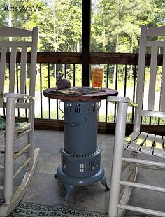 two chairs and a table on a porch