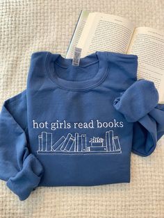 Show off this bookish style with our custom embroidered Hot Girls Read Books sweatshirts. Expressing your love for literature with our funny and uniquely designed bookish sweatshirts, perfect for Book Lovers and avid readers alike. Browse our collection of, custom embroidered sweatshirts and discover the perfect Book merch to express your passion for reading! :) * 50% cotton, 50% polyester * Pre-shrunk * Classic fit * 1x1 athletic rib knit collar with spandex * Air-jet spun yarn with a soft feel Custom Embroidered Sweatshirt, Lover Sweatshirt, Book Clothes, Neue Outfits, Embroidered Crewneck, Girl Reading, Embroidered Clothes, Embroidered Sweatshirt, Funny Sweatshirts