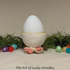 an egg is sitting in the middle of some eggs