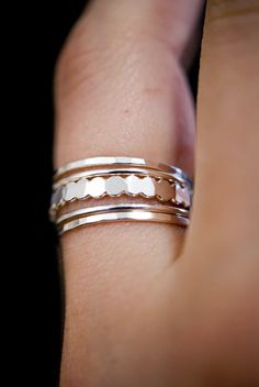 "These rings are handmade by the designer herself in her Portland, OR studio. * MEDIUM THICK RINGS and BEAD RING * These \"medium thick\" rings mix together beautifully! The contrast between smooth, hammered and bead textures is incredibly eye-catching. These stacking rings are perfect for mixing and matching! Either wear them all at once or mix them in with your favorite rings for extra sparkle! Each silver ring is individually cut, soldered and polished for a beautiful hand-crafted, high-quali Thick Stacking Ring, Stacking Rings Gold, Ring Set Silver, Thick Rings, Multi Ring, Thick Ring, Sterling Silver Stacking Rings, Stack Ring