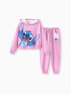 Unleash your child's playful side with this adorable Disney Stitch-themed hoodie and sporty pants set.
* Product features: Girls' hoodie and sporty pants set.
* Fabric characteristics: Soft and comfortable material.
* Piece of product: One hoodie and one pair of sporty pants.
* Neckline: Relaxed fit with dropped shoulders.
* Sleeves: Long sleeves.
* Style: Disney Stitch-themed design with fun graphics.
* Fit: Loose fit.
* Length: Standard. Fun Graphics, Sporty Pants, Character Letters, Girls Hoodie, Sleeves Style, Disney Stitch, Disney Merchandise, Matching Family Outfits, Hoodie Girl