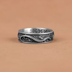 Dragon vs Koi Carp Fish Silver Band Ring, Japanes Traditional Wedding Ring, Dragon Koi Fish Gift Ring, Mythology Band Jewelry, Japanes Rings   Made of 925 silver and handcrafted by hand, this ring is not only an accessory piece that complements your daily elegance, but also has details that will reflect your character and style. It is also a great gift to give to your loved ones on their special days. At SavisSilver, we always give importance to the satisfaction of our customers, we recommend yo Symbolic Oxidized Wedding Rings, Symbolic Wedding Rings With Oxidized Finish, Adjustable Antique Silver Wedding Rings, Dragon Design Anniversary Ring Jewelry, Adjustable Dragon Design Ring, Adjustable Dragon Design Jewelry Ring, Sterling Silver Dragon Design Ring, Collectible Dragon Design Jewelry Ring, Adjustable Ring With Dragon Design