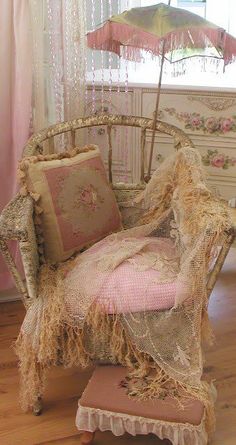 an old fashioned chair and umbrella in a room