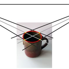 a coffee cup with four black sticks sticking out of it's center and bottom