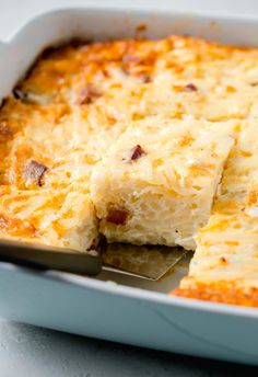 a casserole dish with cheese and bacon in it