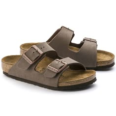 The all-time icon, sized down just for kids. Durable and easy to clean, Birkibuc® gives the two-strap look a brushed, leather-like finish. Complete with classic BIRKENSTOCK design elements, like adjustable buckles and a contoured cork-latex footbed to keep little feet comfortably on the move.   Contoured cork-latex footbed creates custom support with wear Birkibuc® synthetic leather upper Suede footbed lining helps keep you comfortable EVA sole is flexible and lightweight  Two adjustable straps with metal pin buckles “Made in Germany” quality stamp on footbed Mocha Birkenstock, Dream Shoe, Outerwear Women Winter, Time Icon, Base Layer Women, Birkenstock Sandals Arizona, Baby Outerwear, Winter Shoes For Women, Casual Slippers